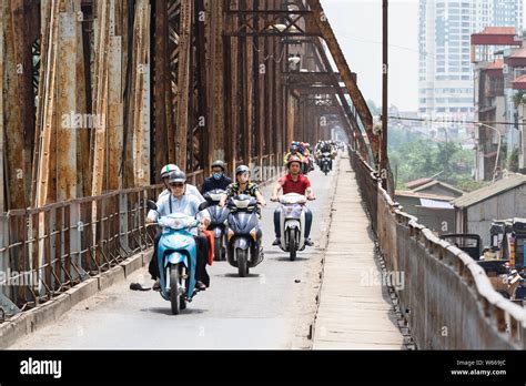 Hanoi, Vietnam - May 2019: people driving scooters and motorbikes on ...