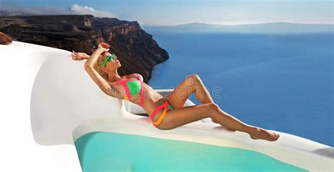Beautiful Female Blonde Model With A Perfect Body And Amazing Long Hair On The Island Of
