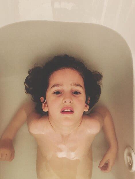 Premium Photo High Angle Portrait Of Naked Girl Sitting In Bathtub