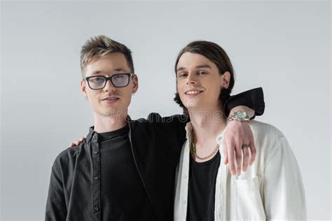 Positive Gay Couple Hugging And Looking Stock Photo Image Of Grey Eyeglasses 250084072