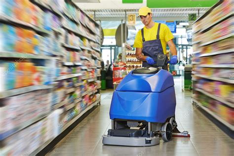 Worker Cleaning Store Floor With Machine — Stock Photo © Kalinovsky