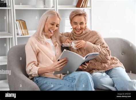 Mature Women Reading Magazine At Home Stock Photo Alamy