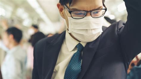 Premium Photo Young Man Wearing Face Mask Travels On Crowded Subway Train