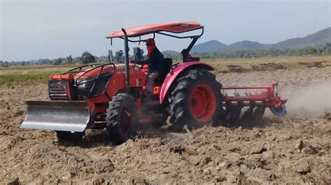 Amazing Tractor Kubota M Su Ploughing The Field At Country Side