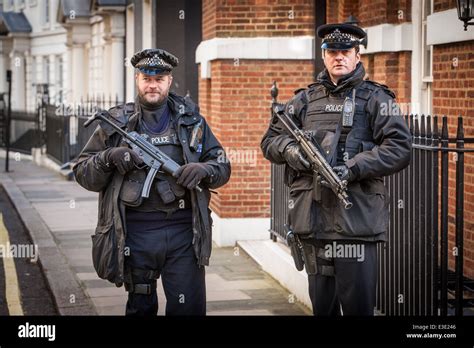 Armed Metropolitan Police Officers On Patrol In Mayfair London Uk