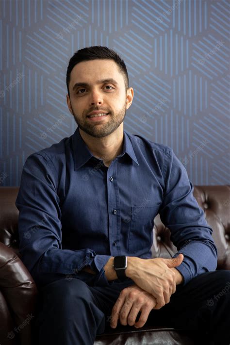 Premium Photo A Man Sitting On The Sofa Looking At Camera