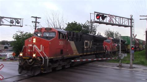 Long Stack Train CN 120 W Mixed Freight DPU At Moncton NB On A Gray