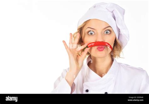 Professional Cook In Chef Hat And Uniform With Mustache From Red Hot Chili Pepper Spicy Food