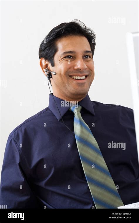 Man working at a computer Stock Photo - Alamy