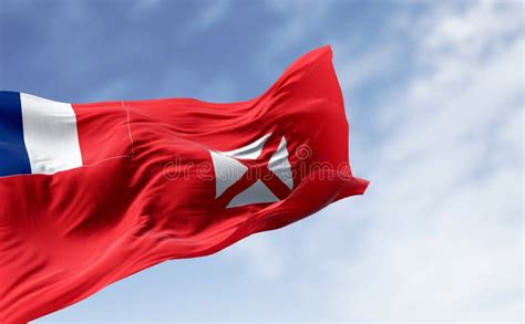 National Flag Of Wallis And Futuna Waving On A Clear Day Stock