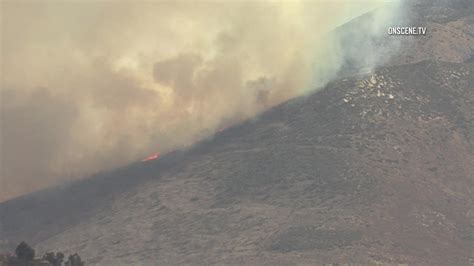 Brush Fire Continues Burning In Tijuana Smoke Visible From San Diego