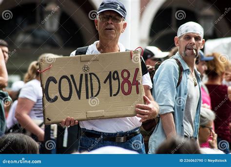 People Protesting In The Street Against The Sanitary Pass With Banner