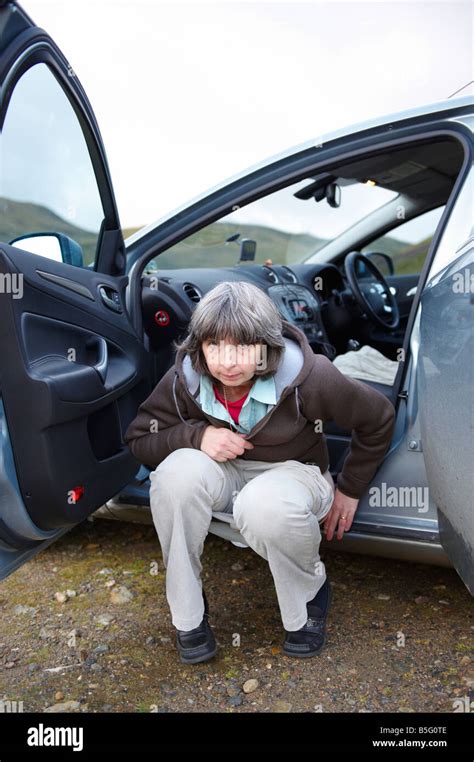 Woman Urinating By Squatting Car Outside In Wilds Stock Photo Alamy