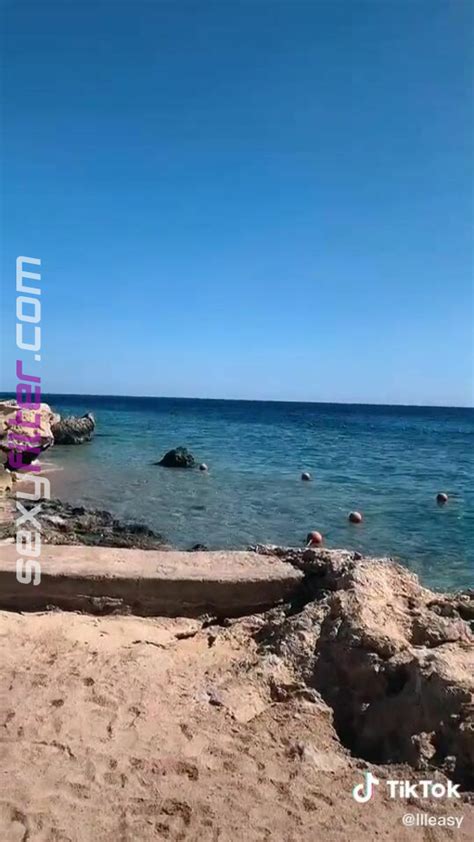 Erotic Elizabeth Anorue Shows Cleavage In White Bikini At The Beach