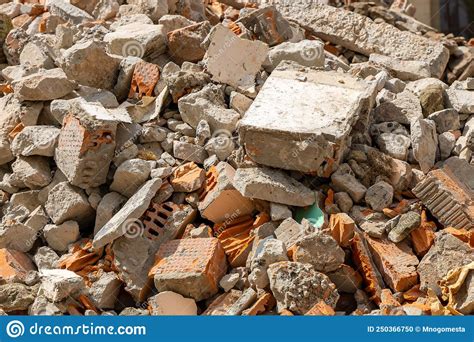 A Pile Of Broken Red Bricks And Fragments Of Concrete A Destroyed