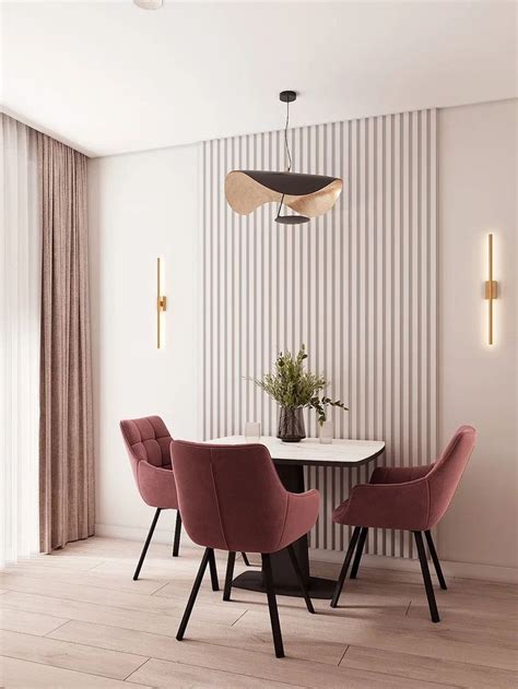 A Dining Room With Pink Chairs And A White Table In Front Of A Striped Wall