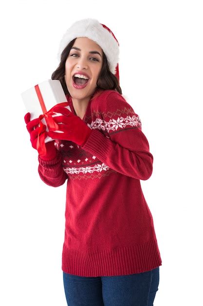 Premium Photo Excited Brunette Showing Christmas Present