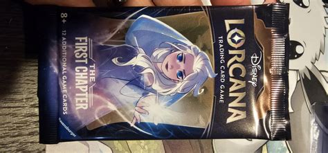 Does TFC reprint accidentally have EN02 printed on the Booster? : r/Lorcana
