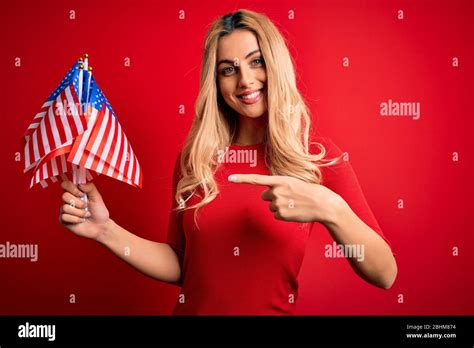 Beautiful Blonde Patriotic Woman Holding United States Flags Celebrating Independence Day Very