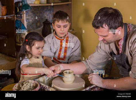 Potter Showing How To Work With Ceramic In Pottery Studio Stock Photo