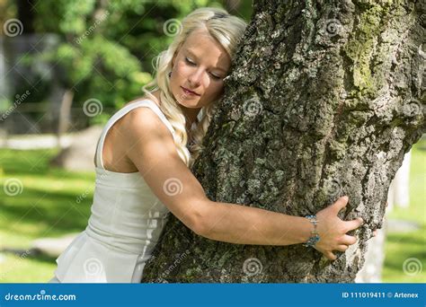 Blonde Woman Hugging A Tree In Park Stock Image Image Of Outdoors