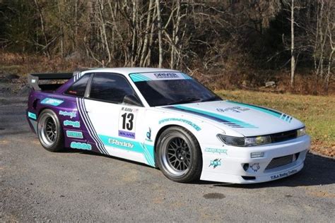 White Car With Purple And Blue Stripes