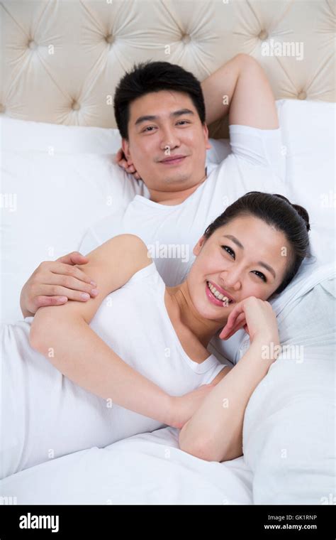 Couple in the bedroom intimacy Stock Photo - Alamy