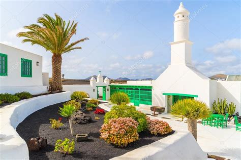 Typical Canarian Style Buildings And Tropical Plants El Campesino