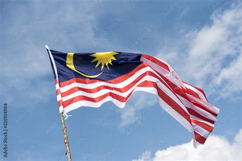 Malaysia Flag Also Known As Jalur Gemilang Wave With The Blue Sky