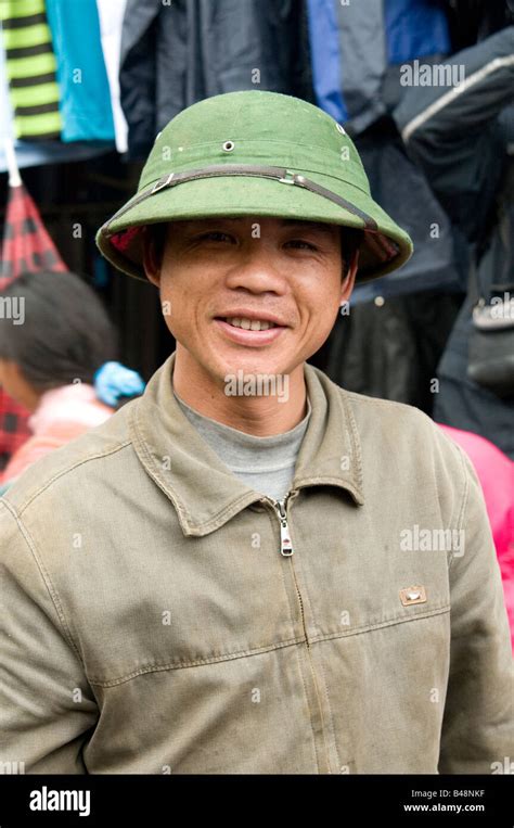 A Portrait Of A Vietnamese Man Wearing The Green Vietnamese Army Hat