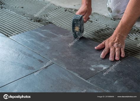 Worker Placing Ceramic Floor Tiles Adhesive Surface Stock Photo By