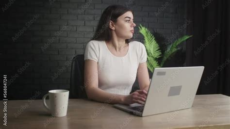 Vid O Stock Female Freelancer Sitting In The Studio With A Cup Of