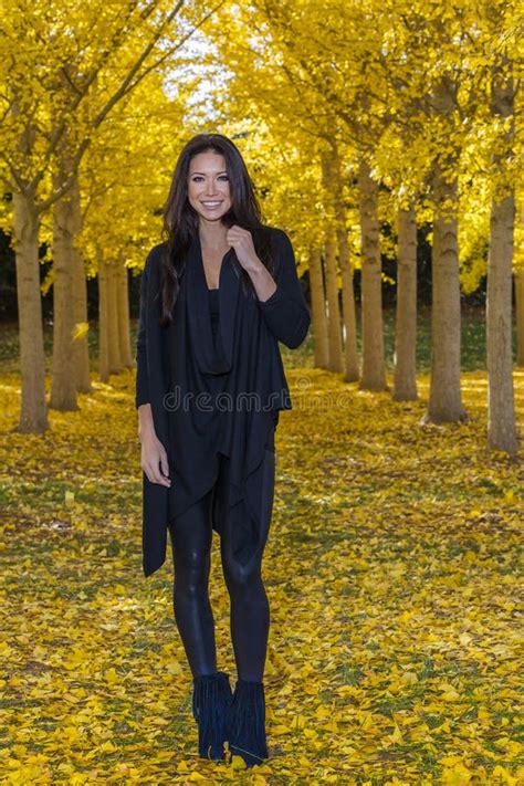 Beautiful Korean Brunette Model Posing In A Field Of Yellow Leav Stock Image Image Of Lovely