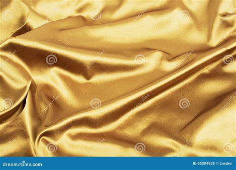 Fundo Dourado Do Cetim Ou Da Seda Luxo Elegante Imagem De Stock