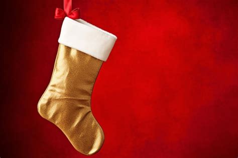 Premium Ai Image Shimmering Gold Christmas Stocking Hanging From