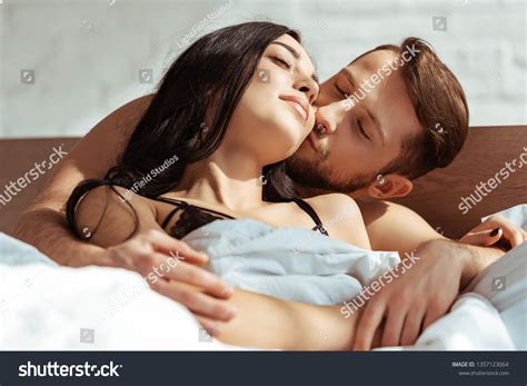 Good Looking Man Kissing Beautiful Brunette Woman Stock Photo Shutterstock