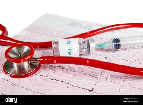 Vaccine bottle with a needle inserted into the bottle with syringe and ...