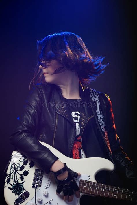 Young Attractive Rock Girl Playing The Electric Guitar Stock Image