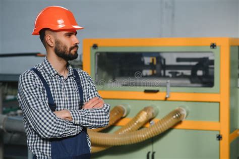 Worker Operating Machine In Factory Stock Photo Image Of Craftsman