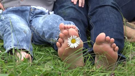 Happy Family Feet Barefoot, Child And Parents Soles In The Grass Stock ...