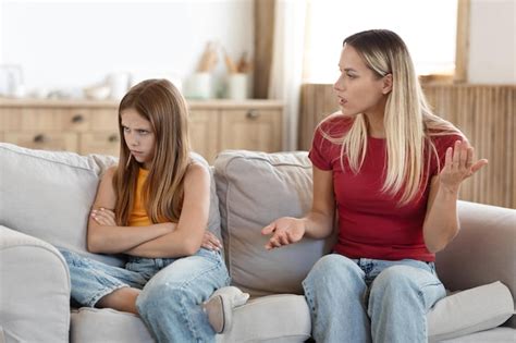 Premium Photo Woman Mother Scolding Her Stubborn Daughter At Home