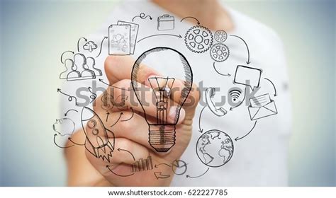 Businessman Drawing Lightbulb Pen Multimedia Icons Stock Photo