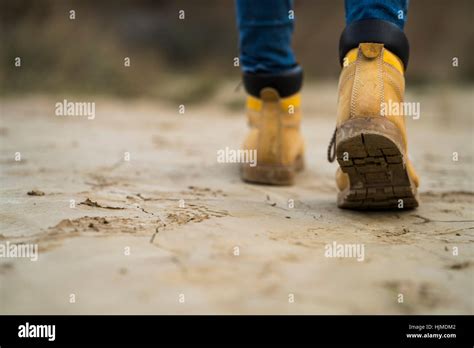 Spain, Navarra, Bardenas Reales, hiking shoes of young woman walking in nature park, close-up ...