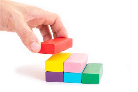 Premium Photo Businessman Hand Holding Wooden Block On White Background