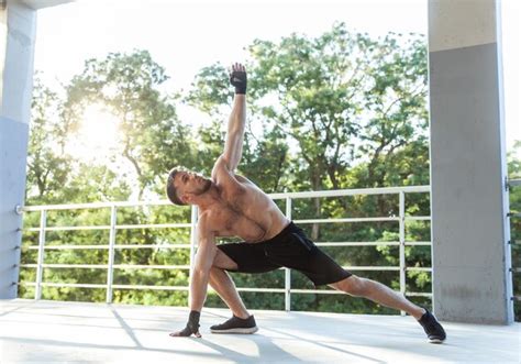 Premium Photo Athletic Man With A Naked Torso Exercising Outdoors Healthy Lifestyle