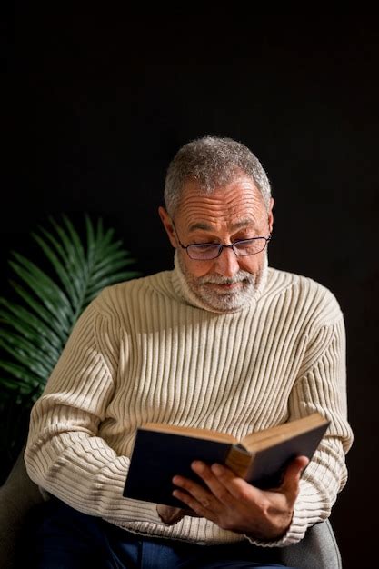 Free Photo Surprised Elderly Man Reading Book