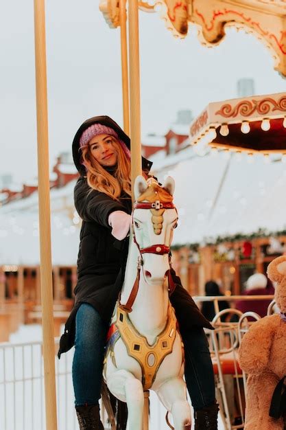 Premium Photo Girl Riding A Carousel With Horses