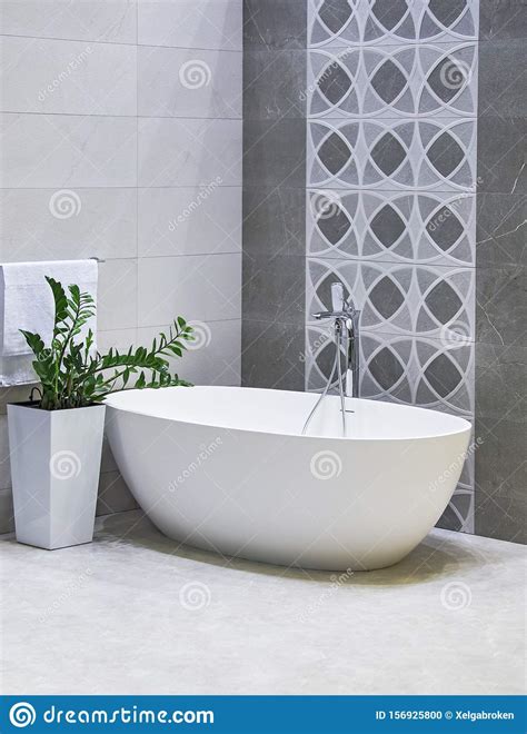 Designed Freestanding Bath In Gray And White Modern Bathroom Stock