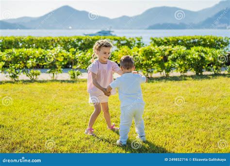 Portrait Of Two Cute Adorable Baby Children Toddlers Hugging And