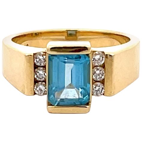 Checkerboard Cut Sky Blue Topaz And Diamond Ring In 14K Yellow Gold For